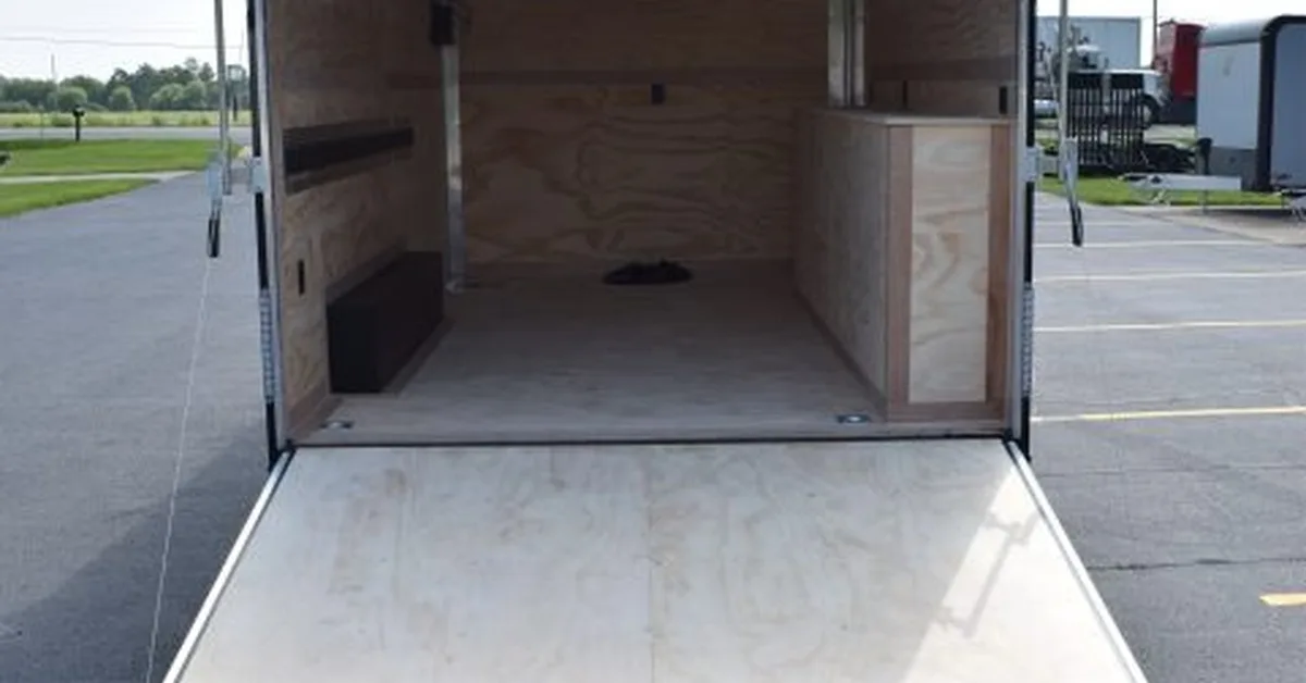 The interior of a contractor tool trailer with all wood lining. The trailer is ready for customization.